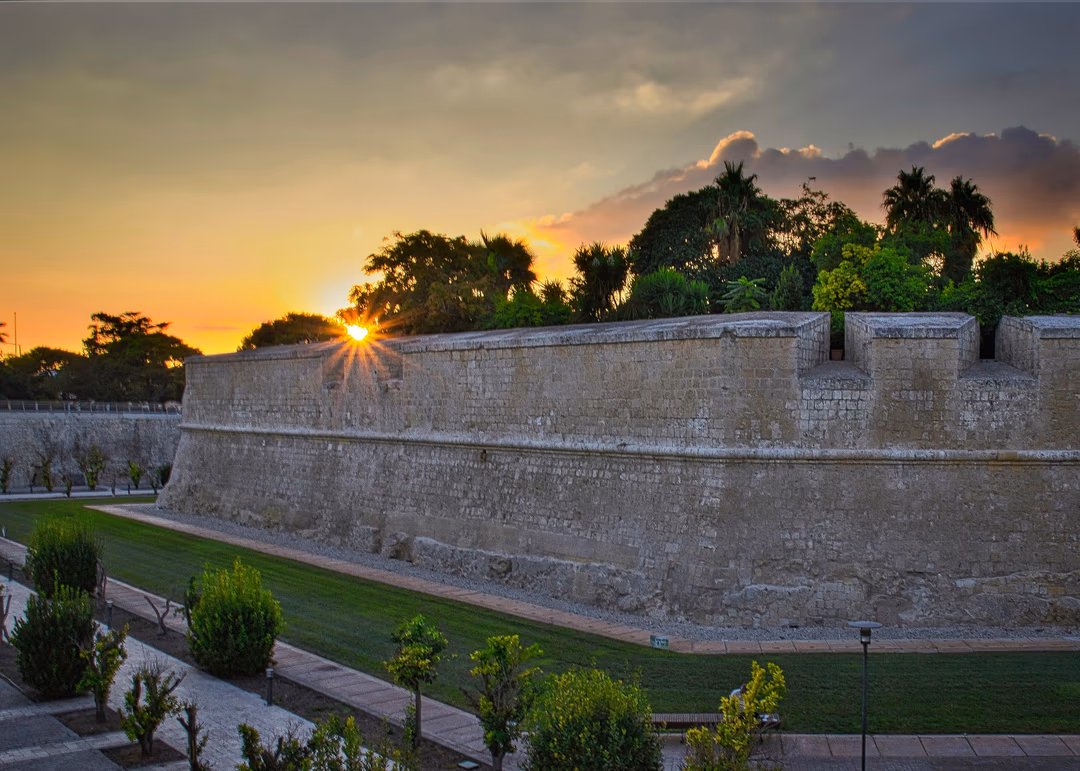 The bastion walls of Mdina glowing at sunset