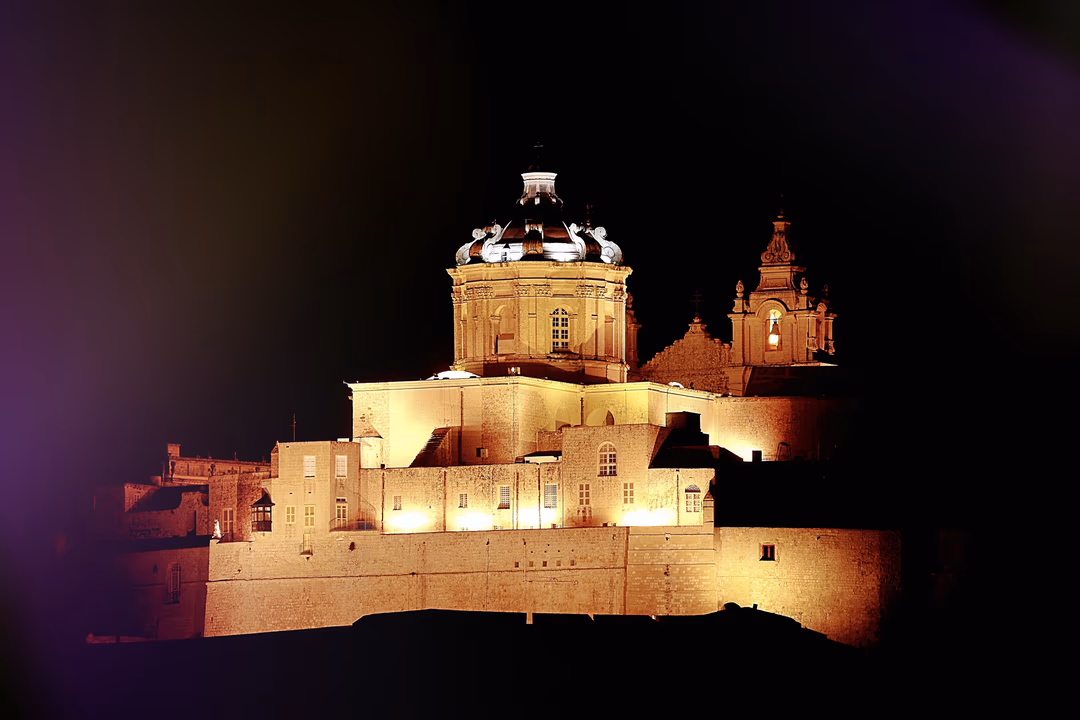 Mdina cathedral and bastions illuminated at night